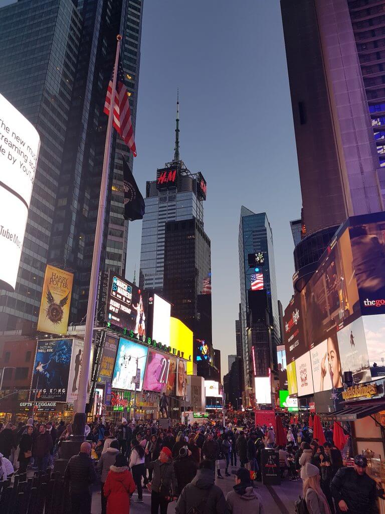 Crowded Times Square at night