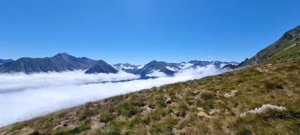 Clouds below the mountain ridge