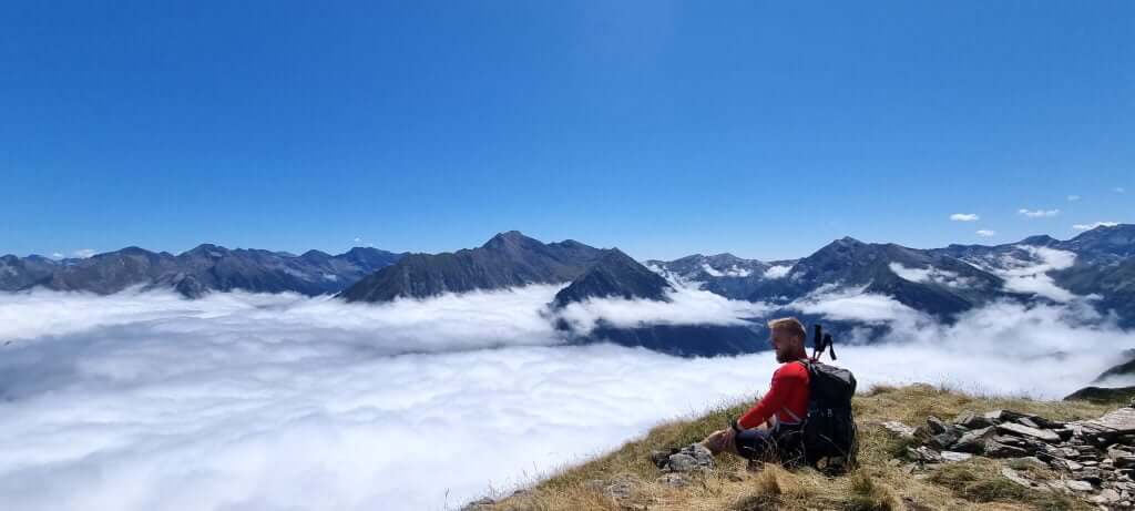 Sitting at summit above the clouds