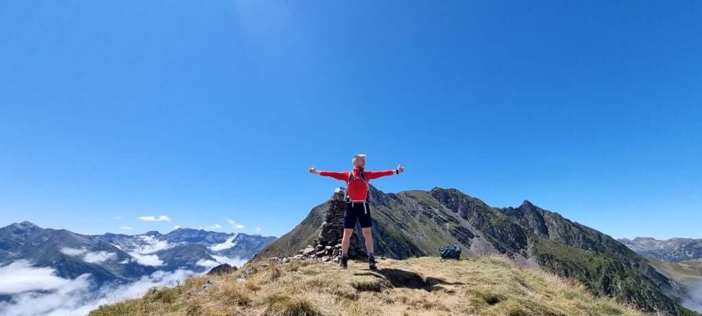 Standing at stone tower at summit
